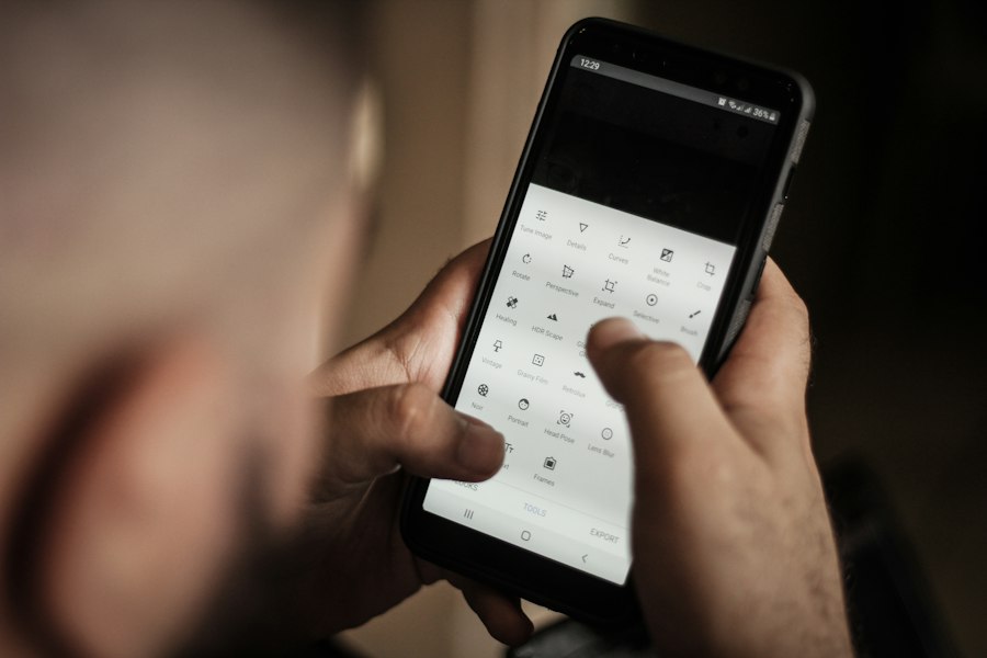 A person dialing on a phone